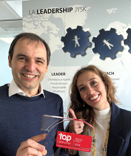 Cesare and Giovanna with Top Employer statuette