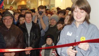 Iryna cutting the ribbon to a JYSK store opening