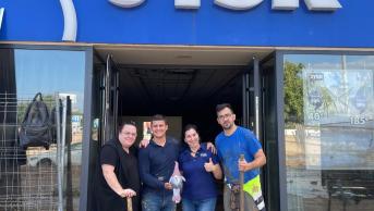 Four JYSK employees standing in store front