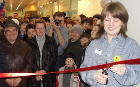 Iryna cutting the ribbon to a JYSK store opening