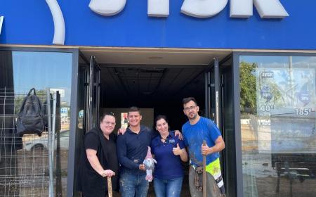 Four JYSK employees standing in store front